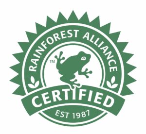 Grønt logo for Rainforest Alliance Certified med en frø i midten og årstallet 1987.